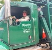 man holding newspaper and briefcase