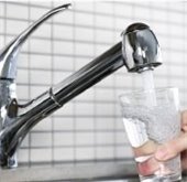 filling up glass ofwater from faucet