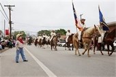 Rodeo caravan strolling through town