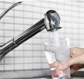 kitchen sink, pouring water into a glass