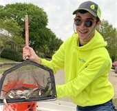 PondMedics worker restocking fish at Palos Verdes Lake