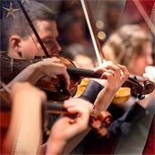 Violinists playing in Mesquite Symphony Orchestra