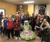 Mesquite Elks Lodge members and partners pictured in front of Christmas tree