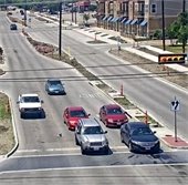 cars at stoplight, road report