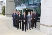 Mesquite City Council posed near front doors of City Hall 