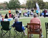 Community members sitting in lawn chairs during previous National Night Out event