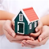 toy house in palm of hands