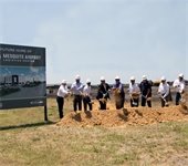 Groundbreaking ceremony, group throws dirt from shovels