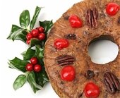 Photo of fruitcake with decorative holly