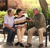 senior sitting together on a bench