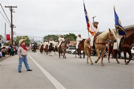 Rodeo caravan strolling through town