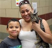 Mom and her son with their new cat they just adopted