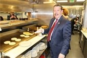 Mayor Pickett flipping pancakes