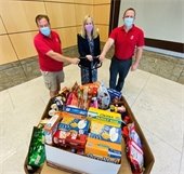 Finance department employees donate t local food pantries