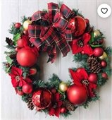 christmas wreath with red ornaments and flowers