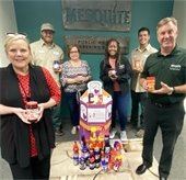 Parks and Rec team with peanut butter and jelly they donated