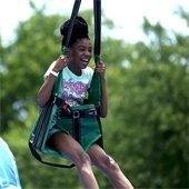 girl swins during summer camp