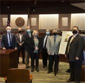 Council members and former Mayor George Venner