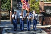 JROTC students in formation carrying fllags