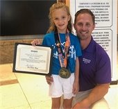 Marlins swimmer Harper Holland pictured with her father
