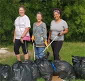 ladies picking up trash