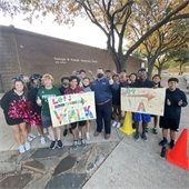 mayor archer poses with students for walk to school day