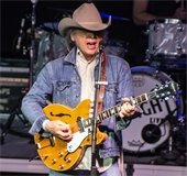 Dwight Yoakam playing guitar