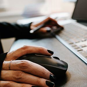 Woman holding a computer mouse