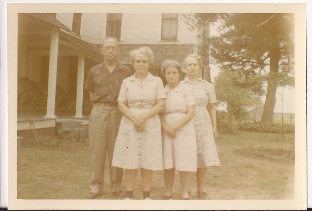 Opal, Garney, Onyx, and Flower in front of house